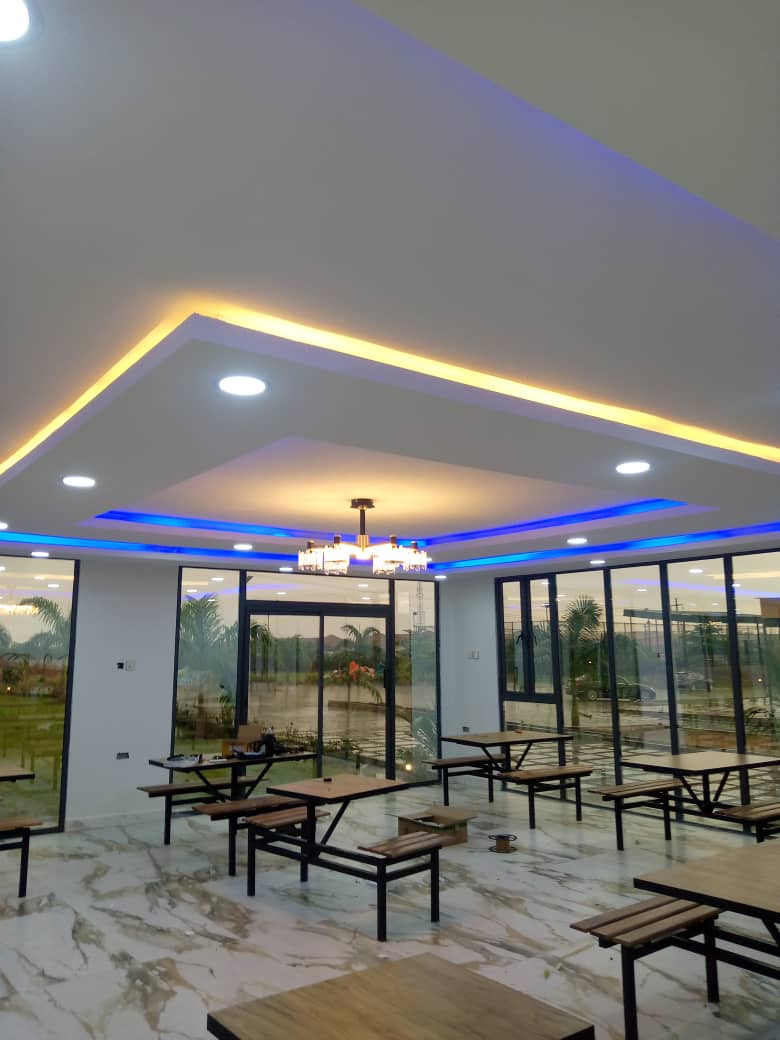 Finished modular event hall interior with feature ceiling and cove lighting